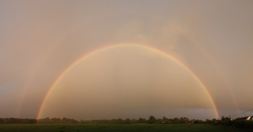 Low sun evening rainbow