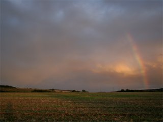 Sunset rainbow and crepuscular rays