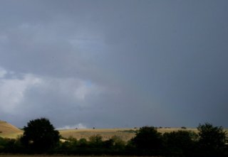 Faint secondary rainbow on its own