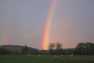 End of bright sunset rainbow