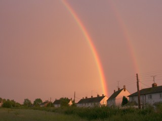 Bright rainbow at sunset