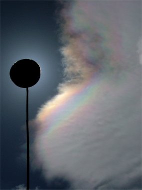 Iridescent bands along the edge of a cloud