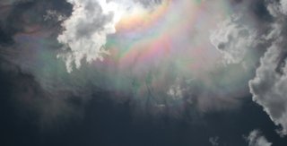 Strong corona merging to iridescence