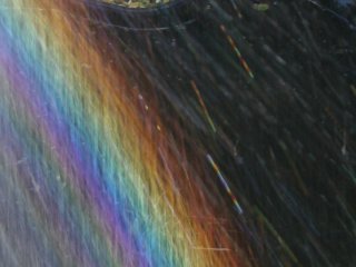 Oscillating drops in a spraybow