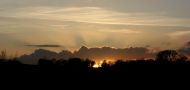 Cloud Shadows and Setting Sun